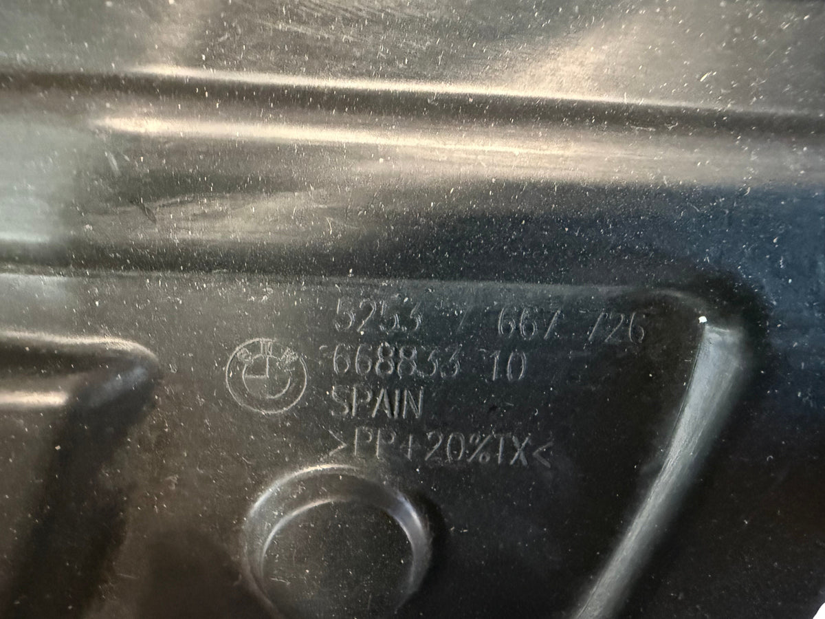 Moulded BMW part number 52537667726 on the seat pan underside