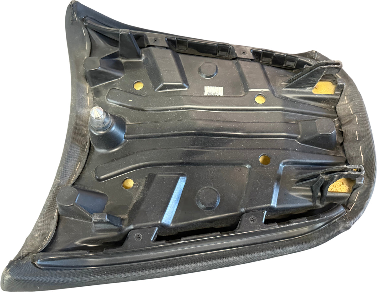 BMW R 1200 GS passenger seat underside showing pan, mounting tabs, locating pin and foam pads